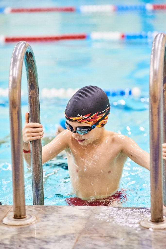 swimming pool, kid, activity, water, child, boy, sport, active, action, athlete, exercise, fitness, race, speed, splashing, swim, swimmer, wellness, wet, energy, nature, pool, swimming, cap, leisure